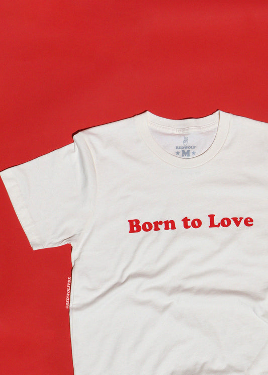 White t-shirt with 'Born to Love' text on a red background