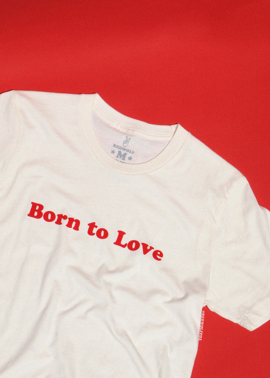 White t-shirt with 'Born to Love' text on a red background