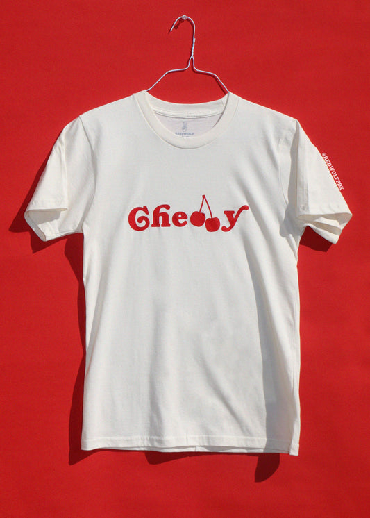 White t-shirt with red cherry graphic on a red background