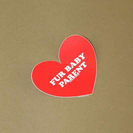 heart shaped red sticker with text 'FUR BABY PARENT' across it on a vintage green background