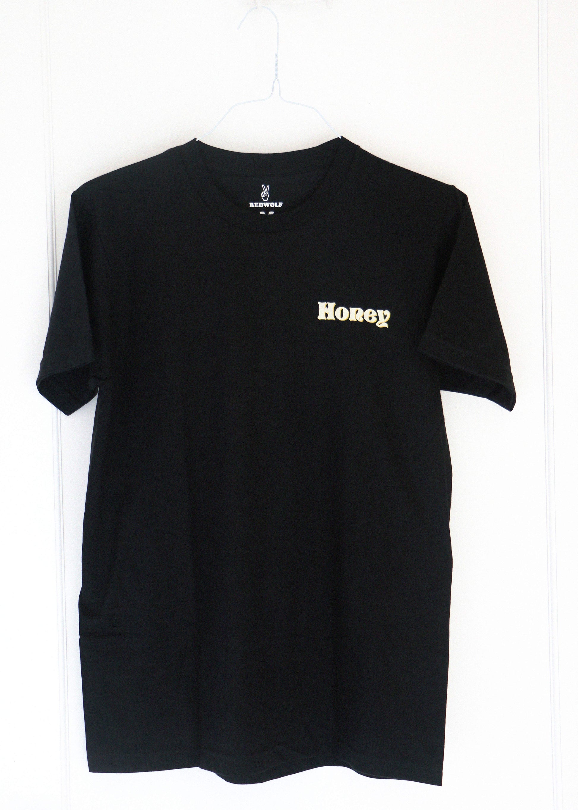 Black t-shirt with 'Honey' text on a white background