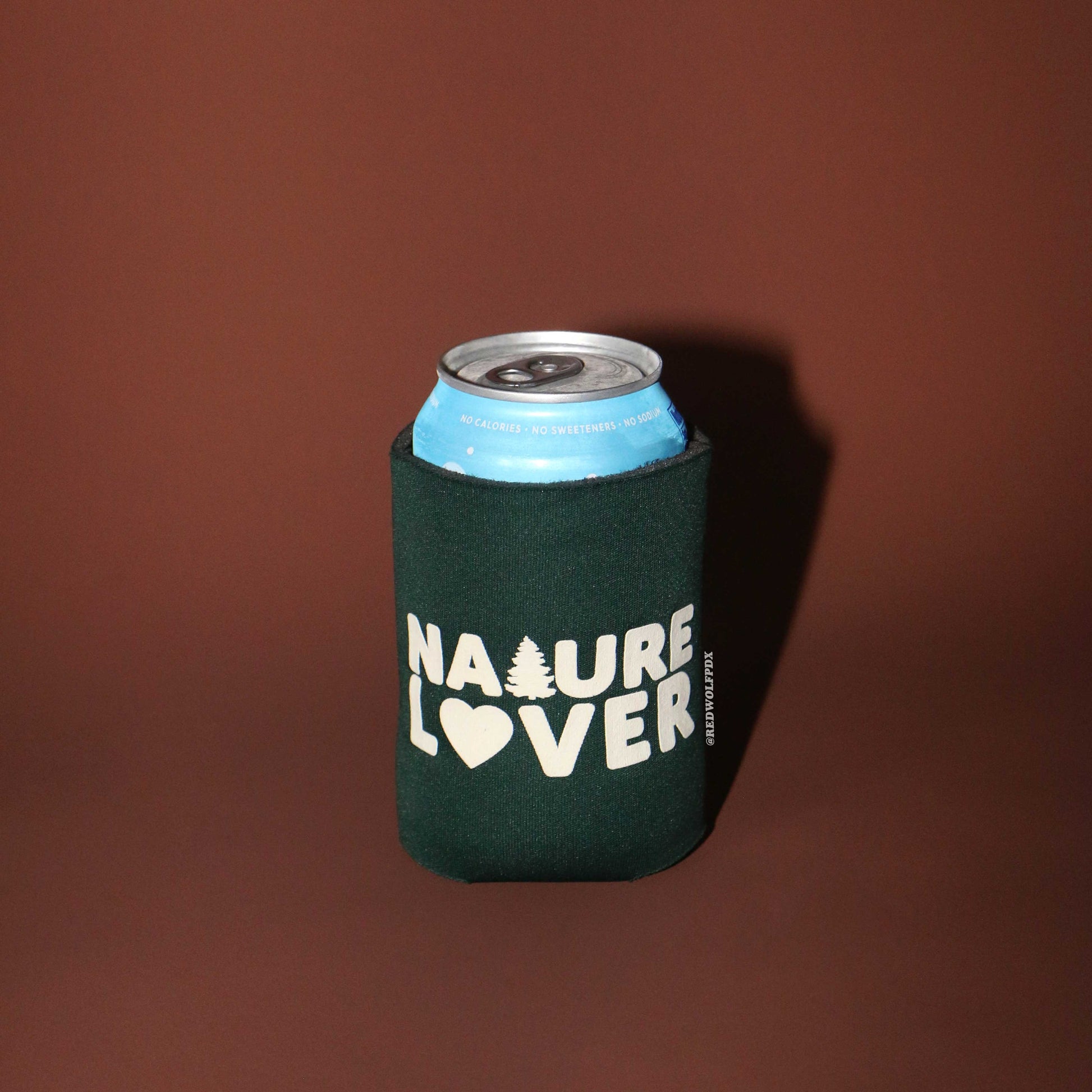forest green neoprene Can cooler with 'Nature Lover' text on a brown background