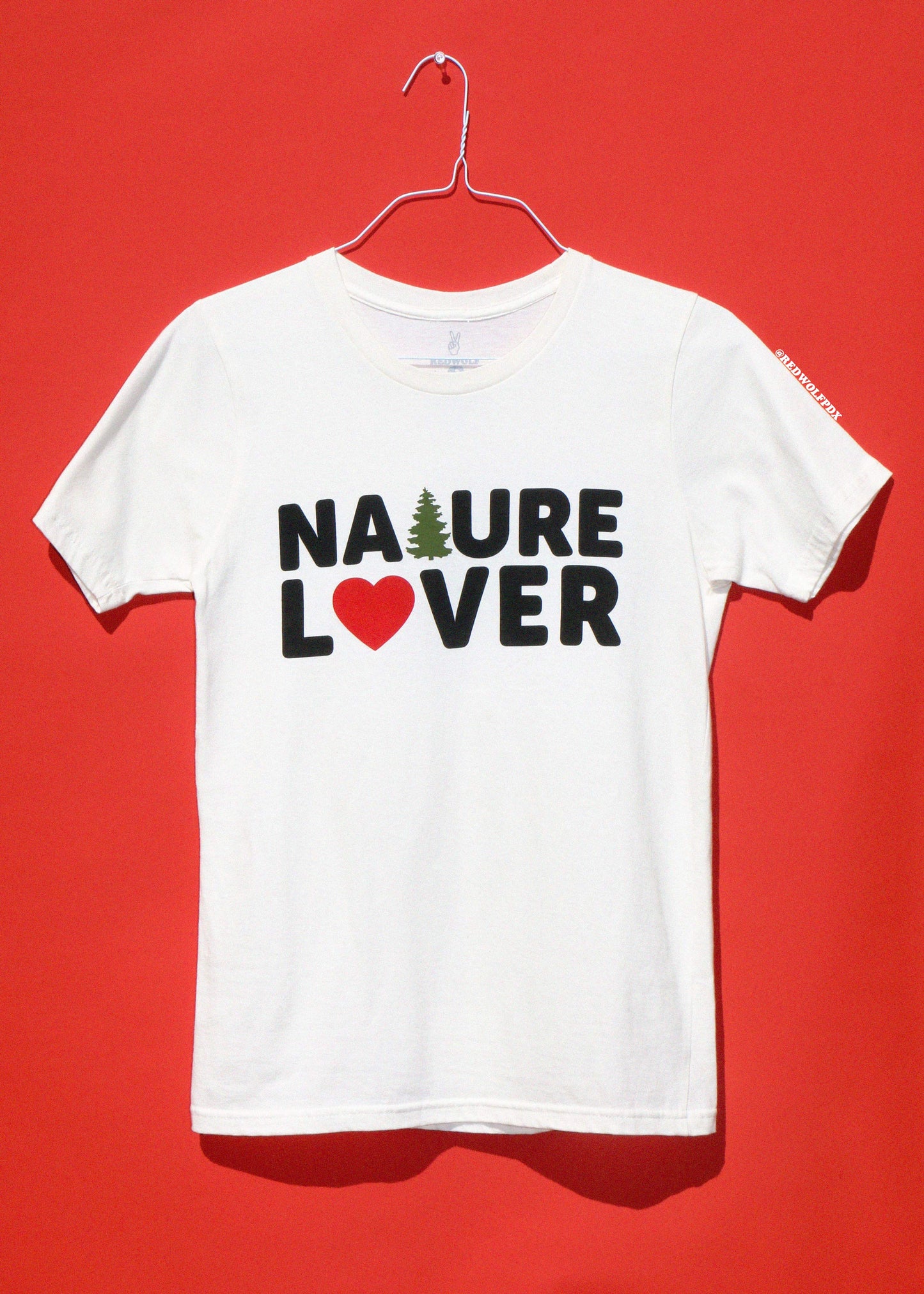 White t-shirt with 'Nature Lover' text on a red background