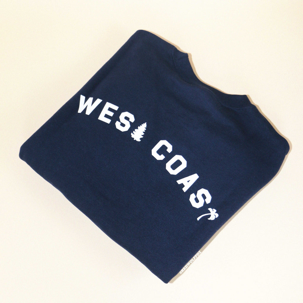 Navy blue sweatshirt with the text 'WEST COAST' printed in white.