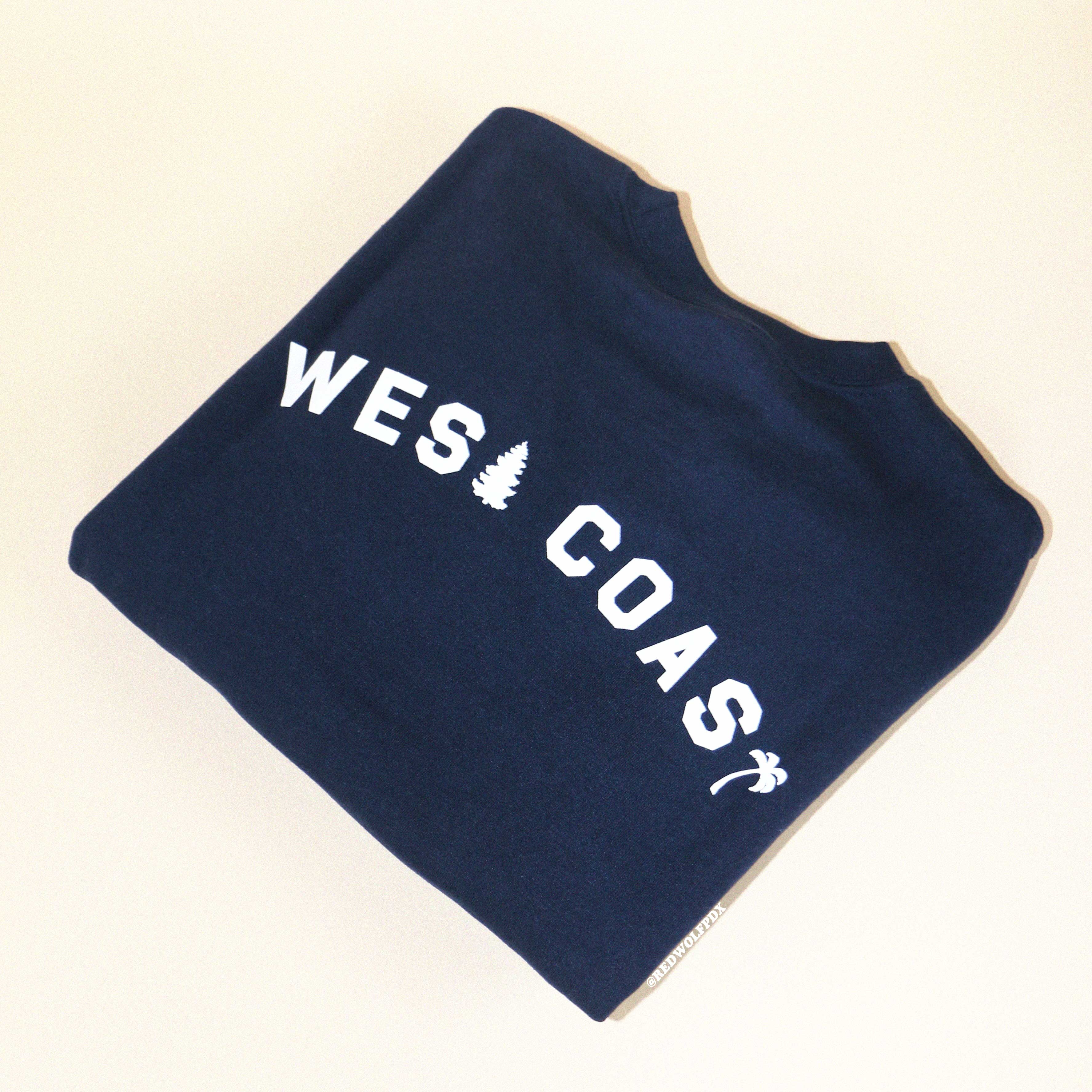 Navy blue sweatshirt with the text 'WEST COAST' printed in white.