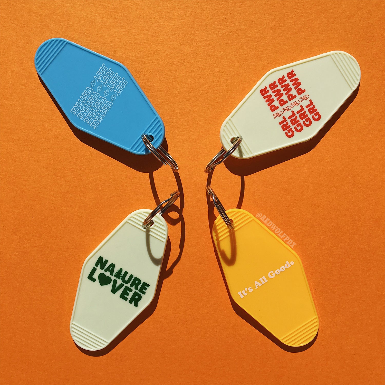retro motel style keychains on orange background