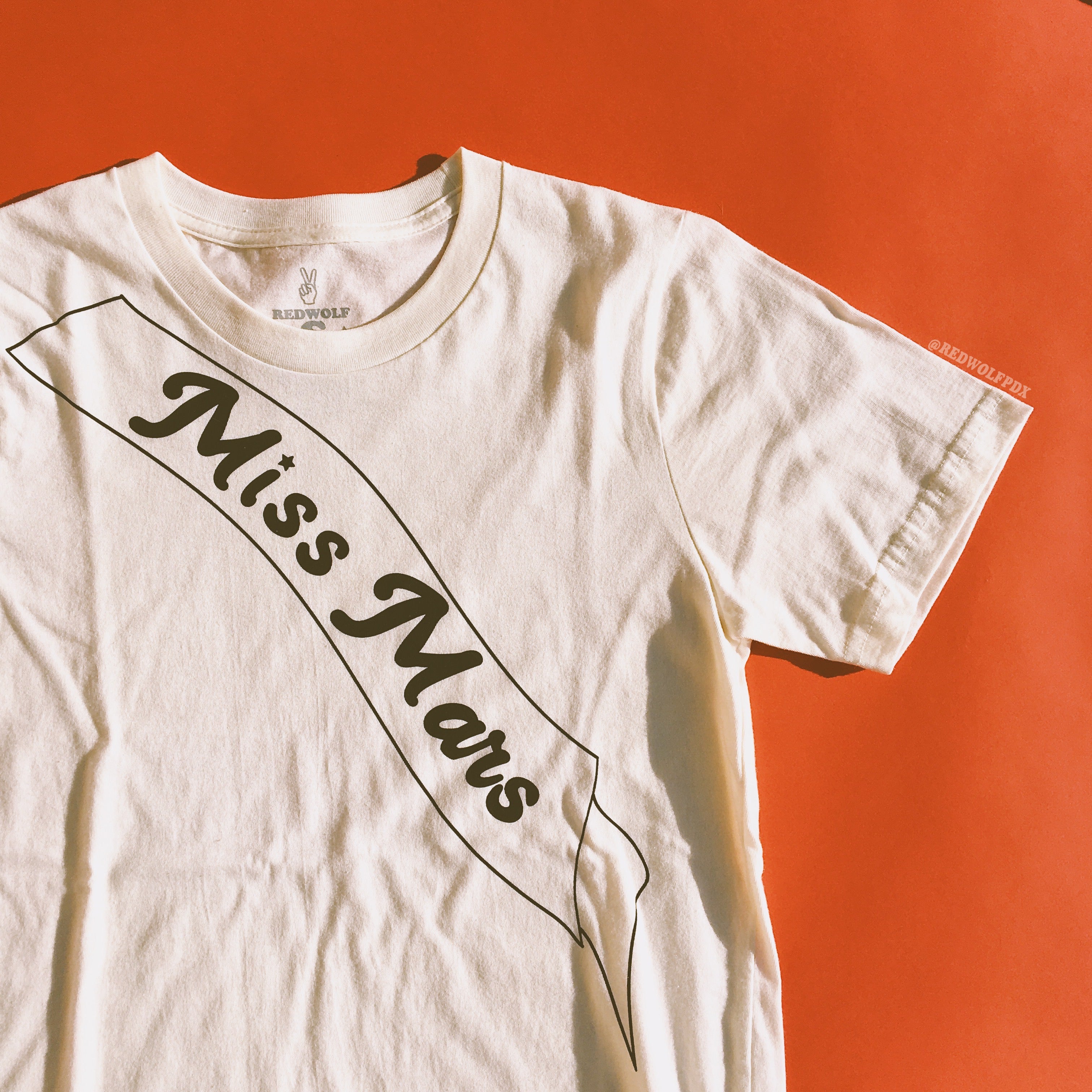 miss mars graphic on tee with retro red backdrop