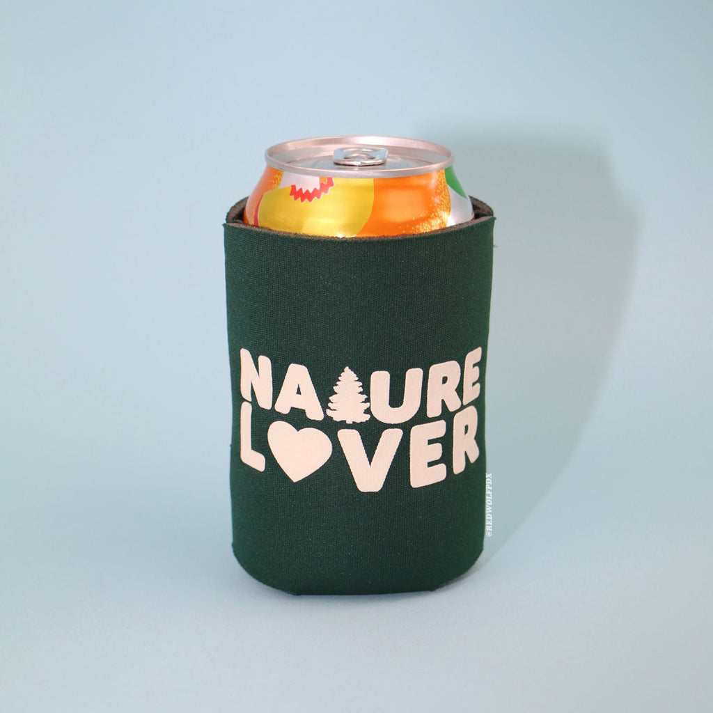 forest green neoprene drink sleeve with white text 'NATURE LOVER' holding a 12 oz can beverage against a blue backdrop